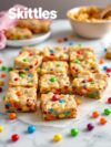 Skittle Rainbow Cookie Bars When… You Need a Little Color in Your Life After a Dull Day.